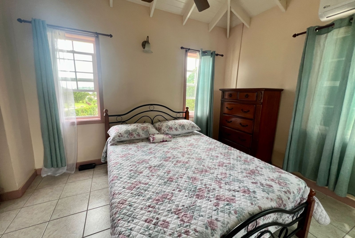 Master bedroom with private balcony overlooking the harbour